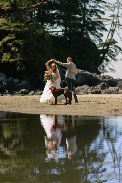 Couple dancing barefoot on the beach